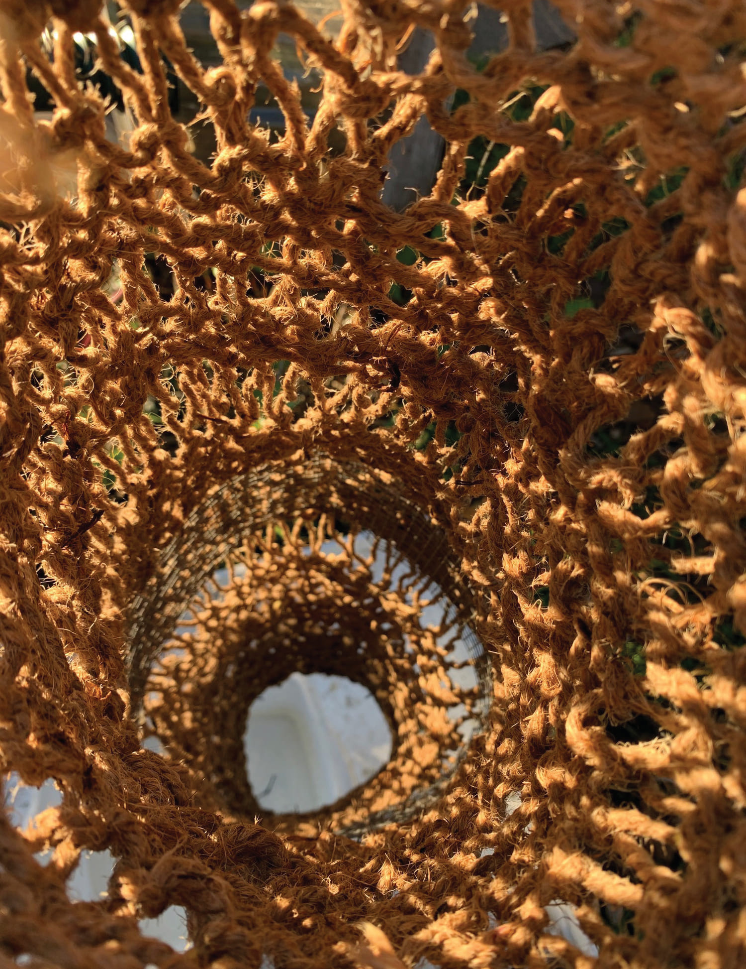 Woven coconut coir basket structure.